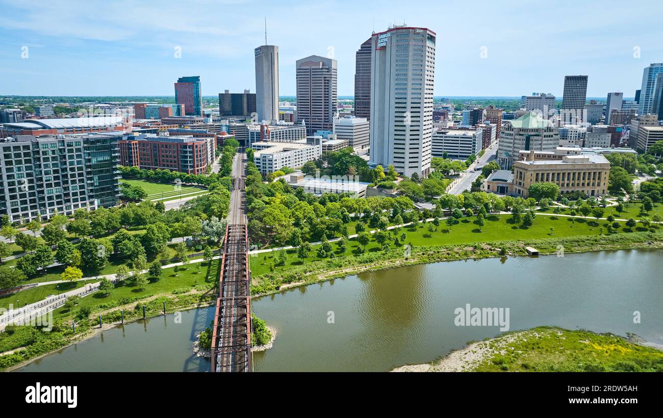 Train bridge leading into downtown of Columbus Ohio past American Electric Power skyscraper aerial Stock Photo