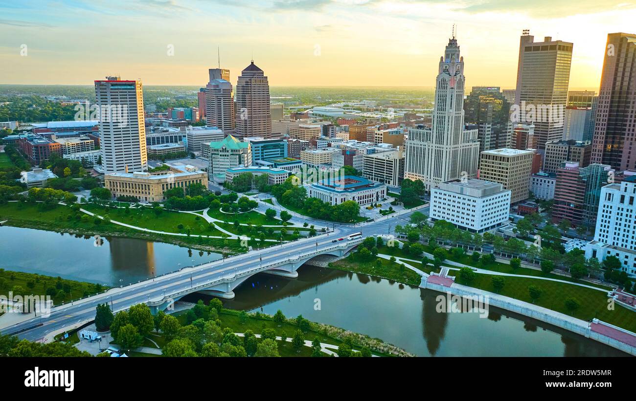 Aerial Scioto River and bridge with park and heart of downtown skyscrapers at sunrise Stock Photo