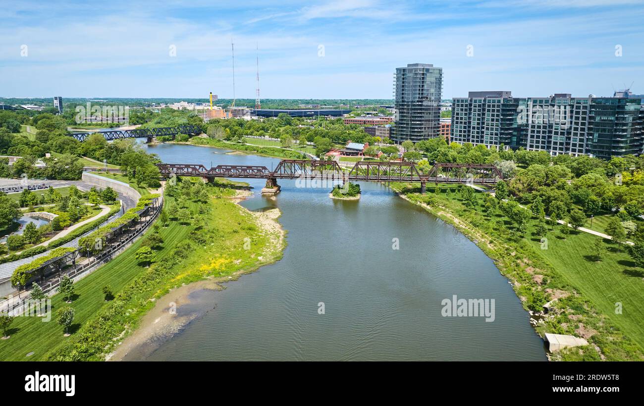 Scioto River aerial with walking bridge and train bridge leading to Columbus Ohio Stock Photo