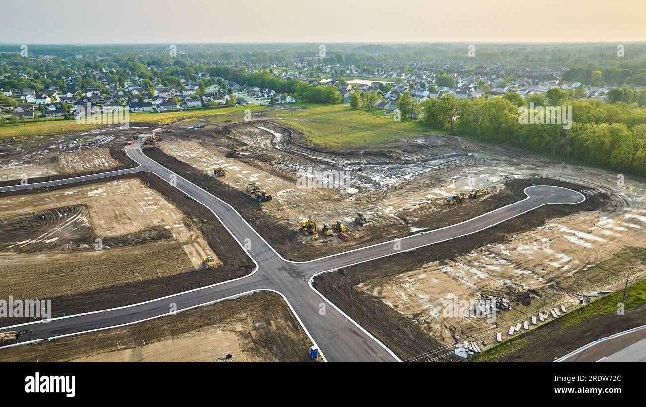 Housing construction aerial bulldozer, bobcat cul-de-sac with paved road  distant houses neighborhood Stock Photo - Alamy