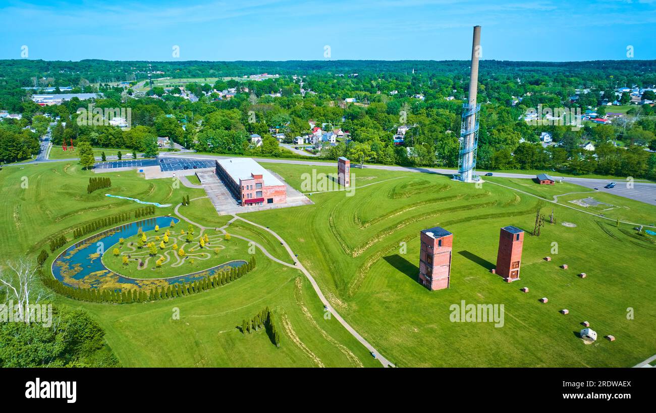 Wide view of Ariel Foundation Park destroyed glass factory and tree