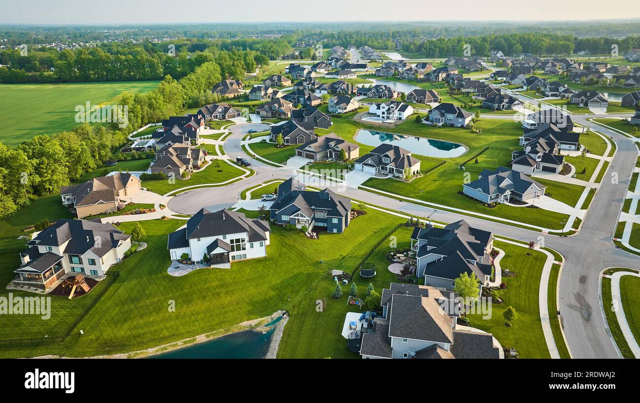 Arial of neighborhood with cul-de-sacs mini mansion high-end million-dollar homes some construction Stock Photo