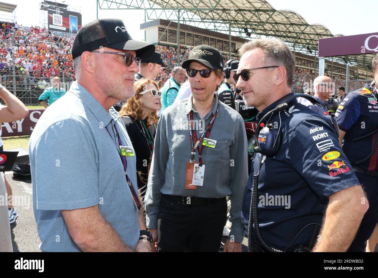 MOGYOROD, BUDAPEST, Hungary. 23rd July, 2023. Red Bull Racing Team Principal Christian Horner talks with Chad Oman, producer of the Formula One based movie Apex, and Jerry Bruckheimer, producer of the upcoming Formula One based movie, Apex, on the grid prior to the F1 Grand Prix of Hungary at Hungaroring on July 23, 2023 in Budapest, Hungary.Formula One race, F1 Grand Prix - Formel 1 Ungarn - Formel 1 - Honorarpflichtiges Foto, Fee liable image, Copyright © THILL Arthur/ATPimages (THILL Arthur/ATP/SPP) Credit: SPP Sport Press Photo. /Alamy Live News Stock Photo