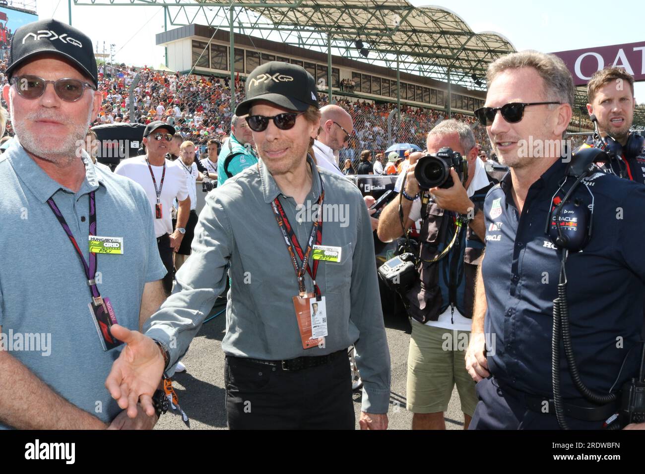 MOGYOROD, BUDAPEST, Hungary. 23rd July, 2023. Red Bull Racing Team Principal Christian Horner talks with Chad Oman, producer of the Formula One based movie Apex, and Jerry Bruckheimer, producer of the upcoming Formula One based movie, Apex, on the grid prior to the F1 Grand Prix of Hungary at Hungaroring on July 23, 2023 in Budapest, Hungary.Formula One race, F1 Grand Prix - Formel 1 Ungarn - Formel 1 - Honorarpflichtiges Foto, Fee liable image, Copyright © THILL Arthur/ATPimages (THILL Arthur/ATP/SPP) Credit: SPP Sport Press Photo. /Alamy Live News Stock Photo