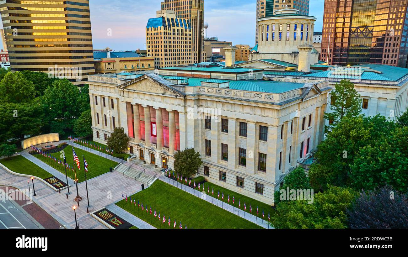 Golden sunrise hitting building windows above Capital Square Foundation