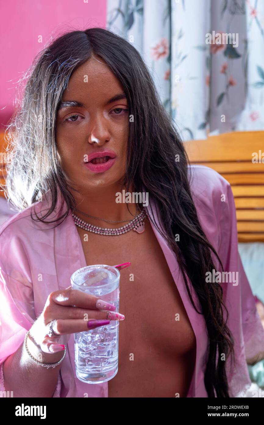 Pretty girl with insomnia trying to cool down and sleep in hot weather