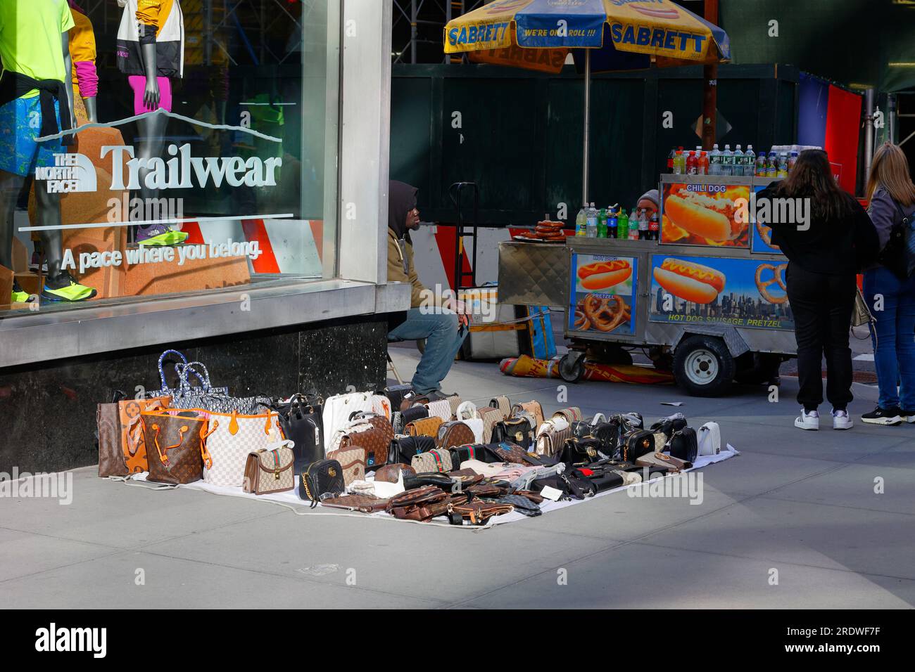 An unlicensed street vendor selling counterfeit handbags and fake purses on Fifth Ave in Midtown