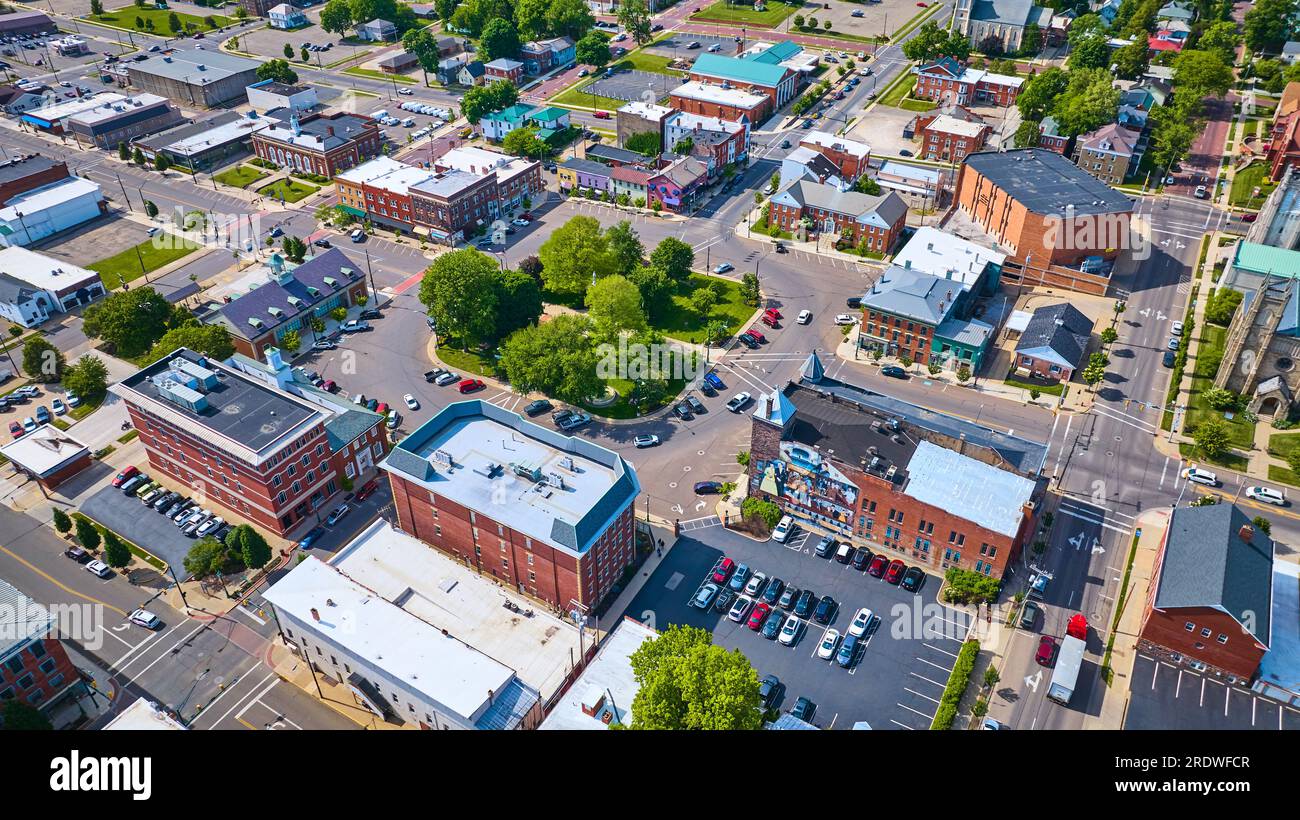 Aerial small town Mount Vernon with green park in center and parking ...