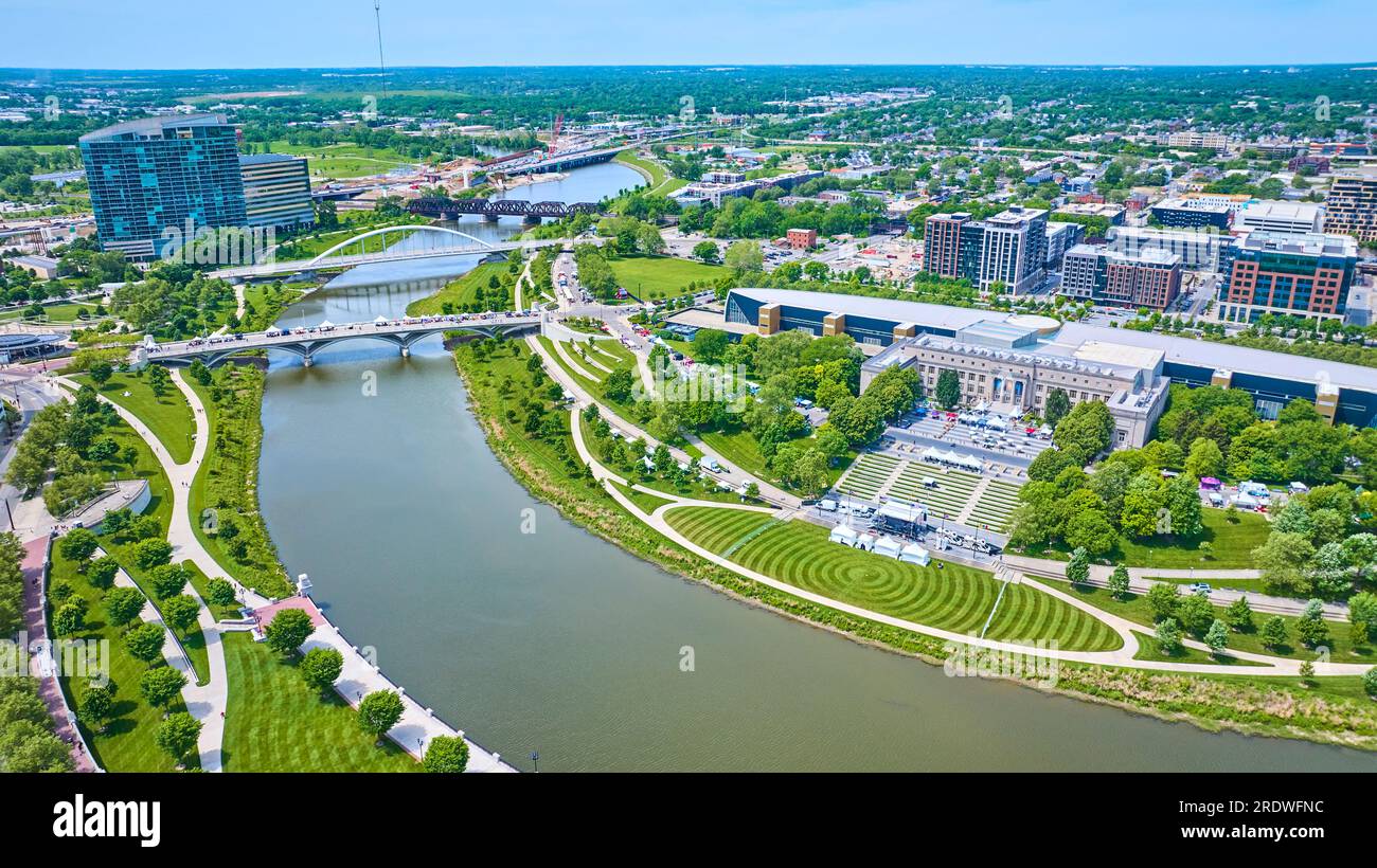 Aerial Scioto Mile Greenway and promenade with winding river leading out of Columbus city Stock Photo