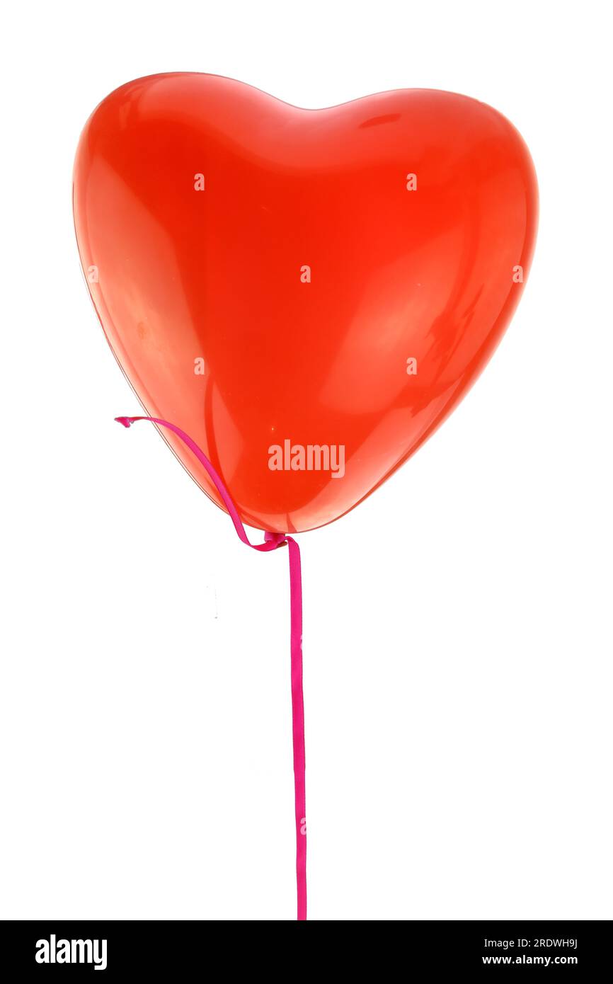 Red heart shape balloon and ribbon flying isolated on white background ...