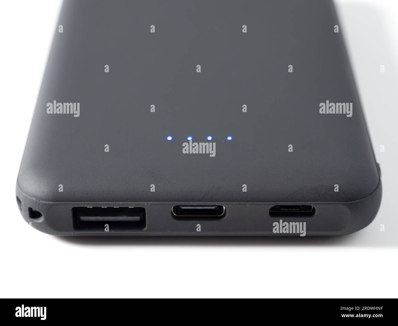 Power bank for charging mobile devices on a white background ...