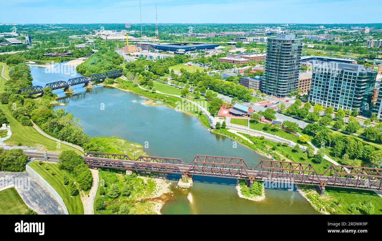 Aerial train bridge and walking bridge over water near Columbus Ohio Stock Photo