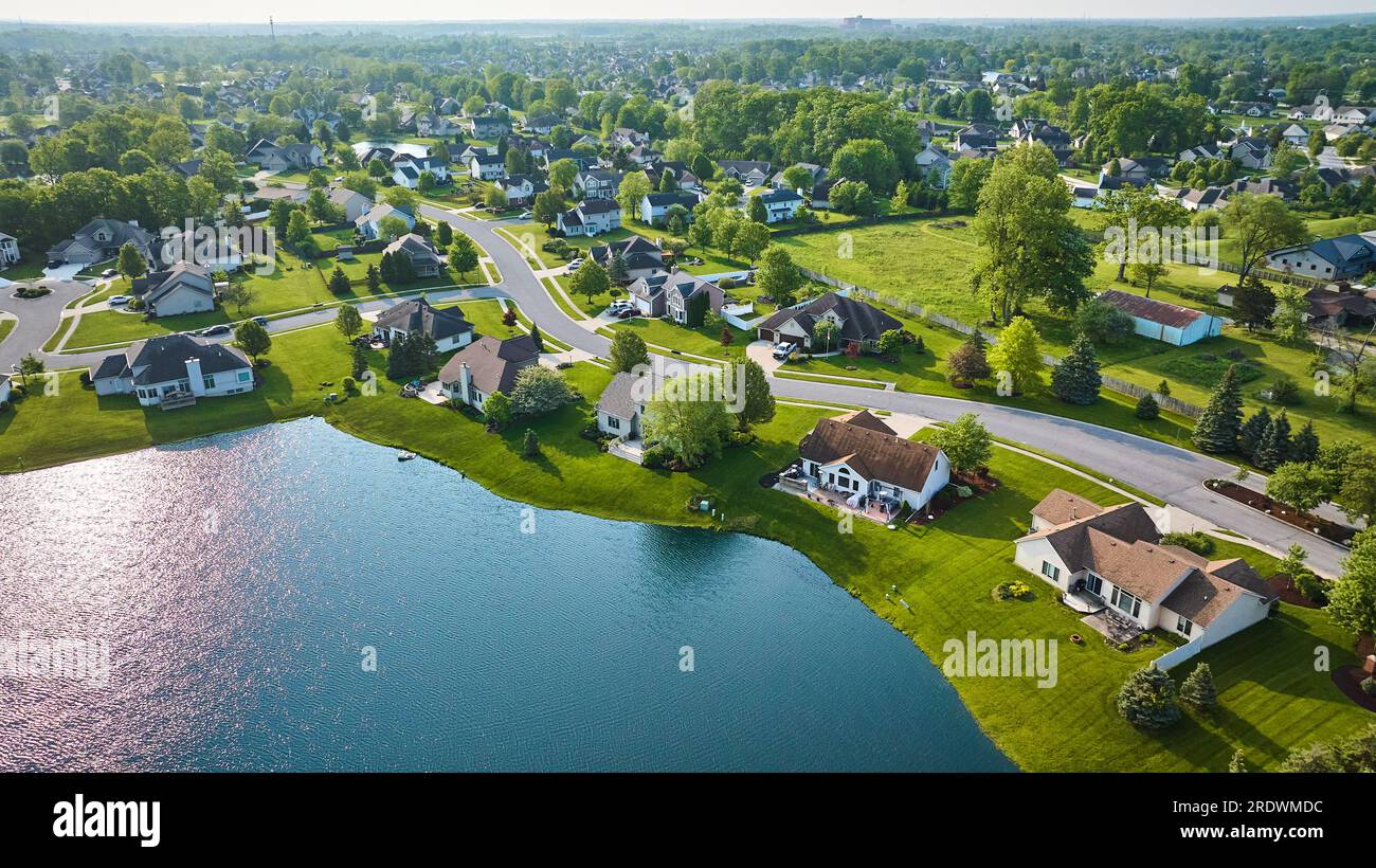 House homes in neighborhood with pond pondside houses aerial Stock