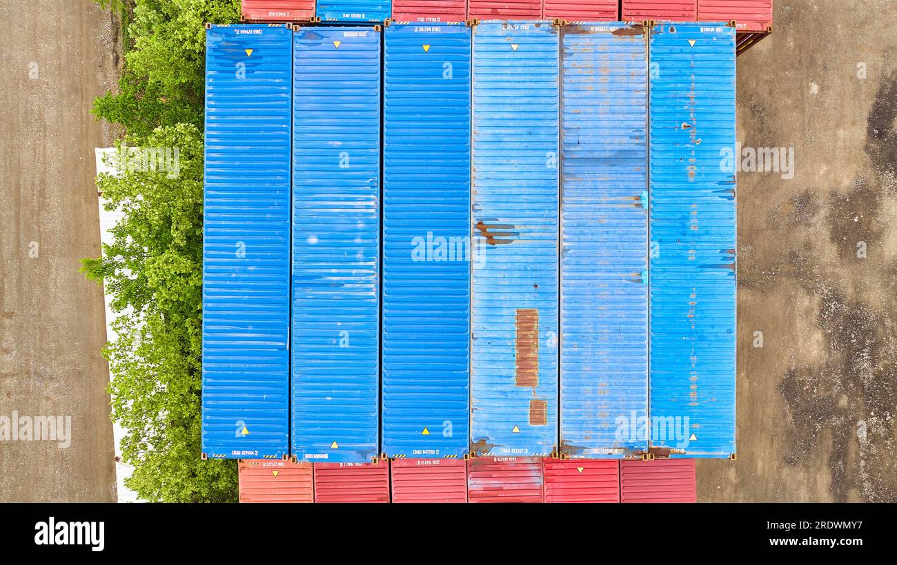 Pastel blue shipping containers like chalk in overhead aerial of ...