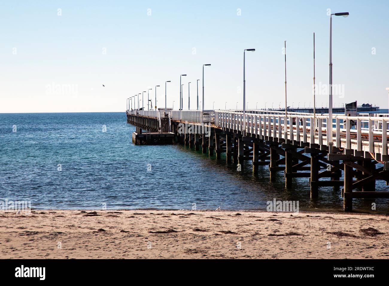 Historic Busselton Jetty extends over protected waters of Geographe Bay of the Indian Ocean in Busselton, Western Australian Stock Photo