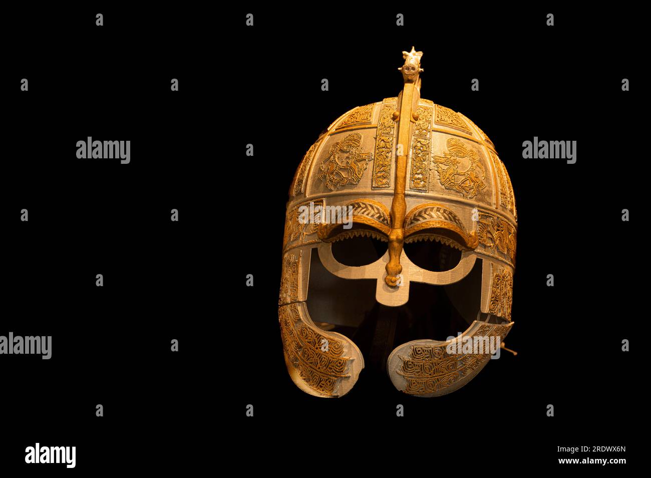 golden medieval helmet isolated on black, Sweden, July 19, 2023 Stock Photo