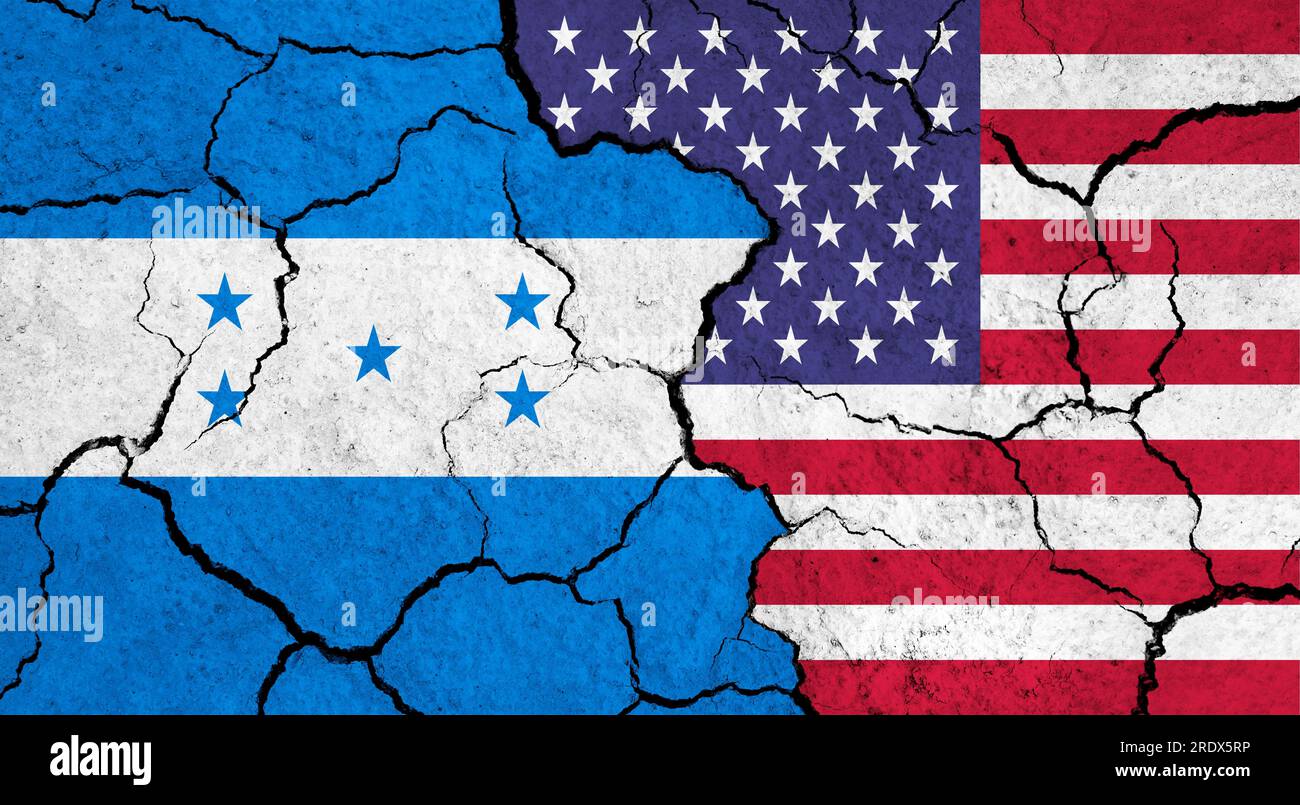 Flags of Honduras and USA on cracked surface - politics, relationship concept Stock Photo