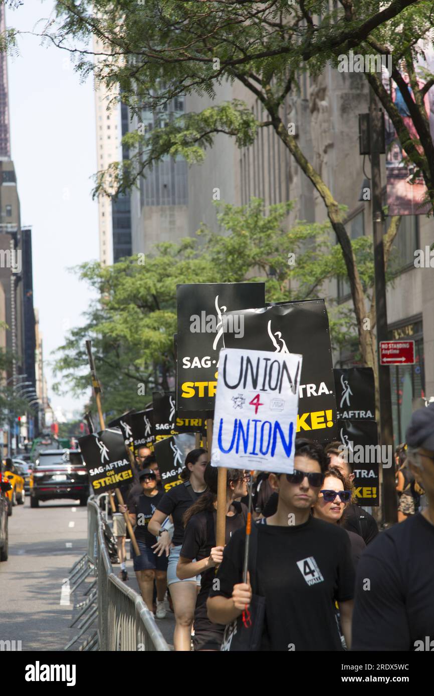 New York City: The strike continues among Writers Guild of America along with SAG-AFTRA  Union members with picket lines in multiple locations in in Manhattan. Strikers demonstrate outside NBC Studios on W. 49th Street by Rockefeller Center, crippling the entertainment industry. Stock Photo