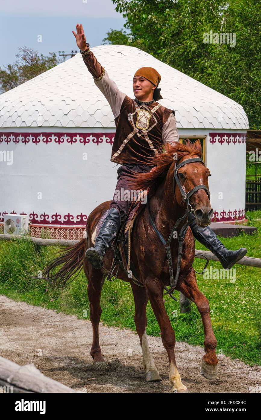 Kazakhstan, Huns Ethno Village. Demonstration of Traditional Kazakh Nomadic Riding Skill. Stock Photo