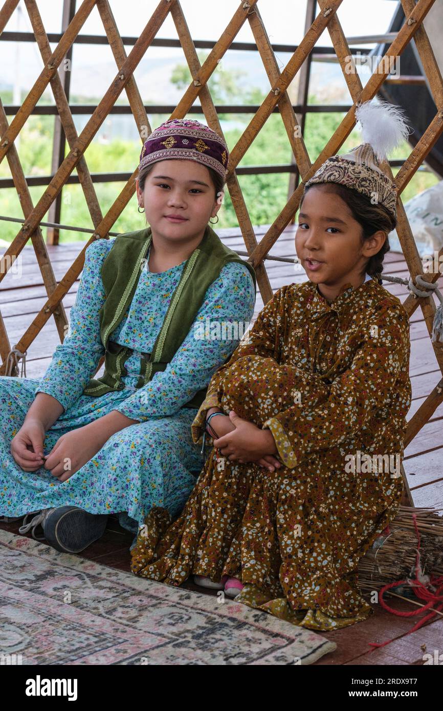 Kazakhstan, Huns Ethno Village. Young Kazakh Girls in Traditional Dress. Stock Photo