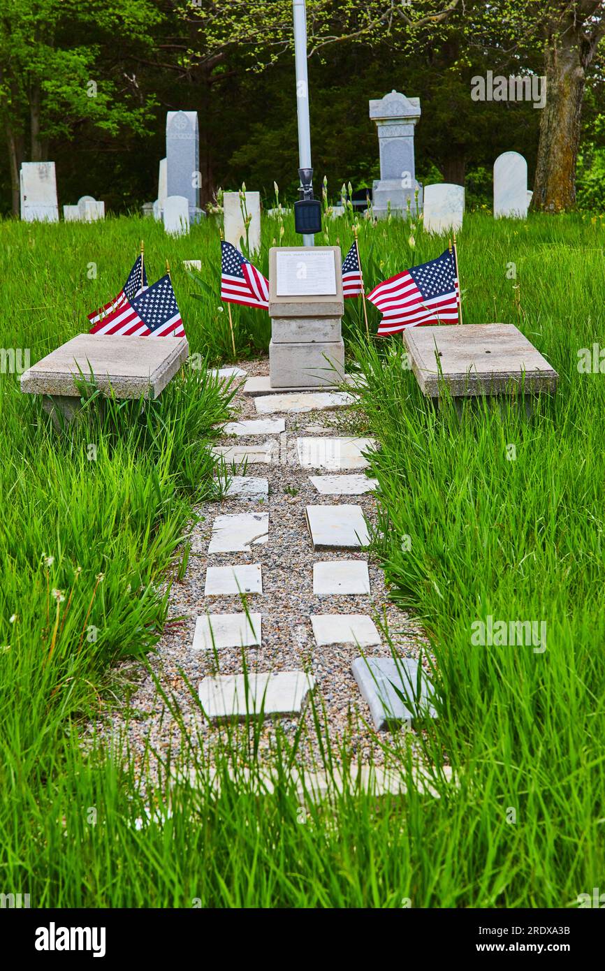 Memorial, graveyard, grave stones, carved names, American flags, graves