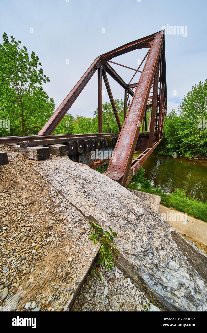 Concrete floor supporting iron railroad bridge over Kokosing River on 