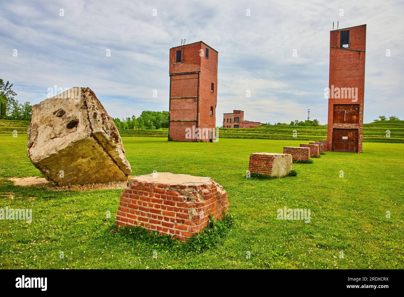 Summer at Ariel Foundation Park with tiered grass hill and abandoned ...