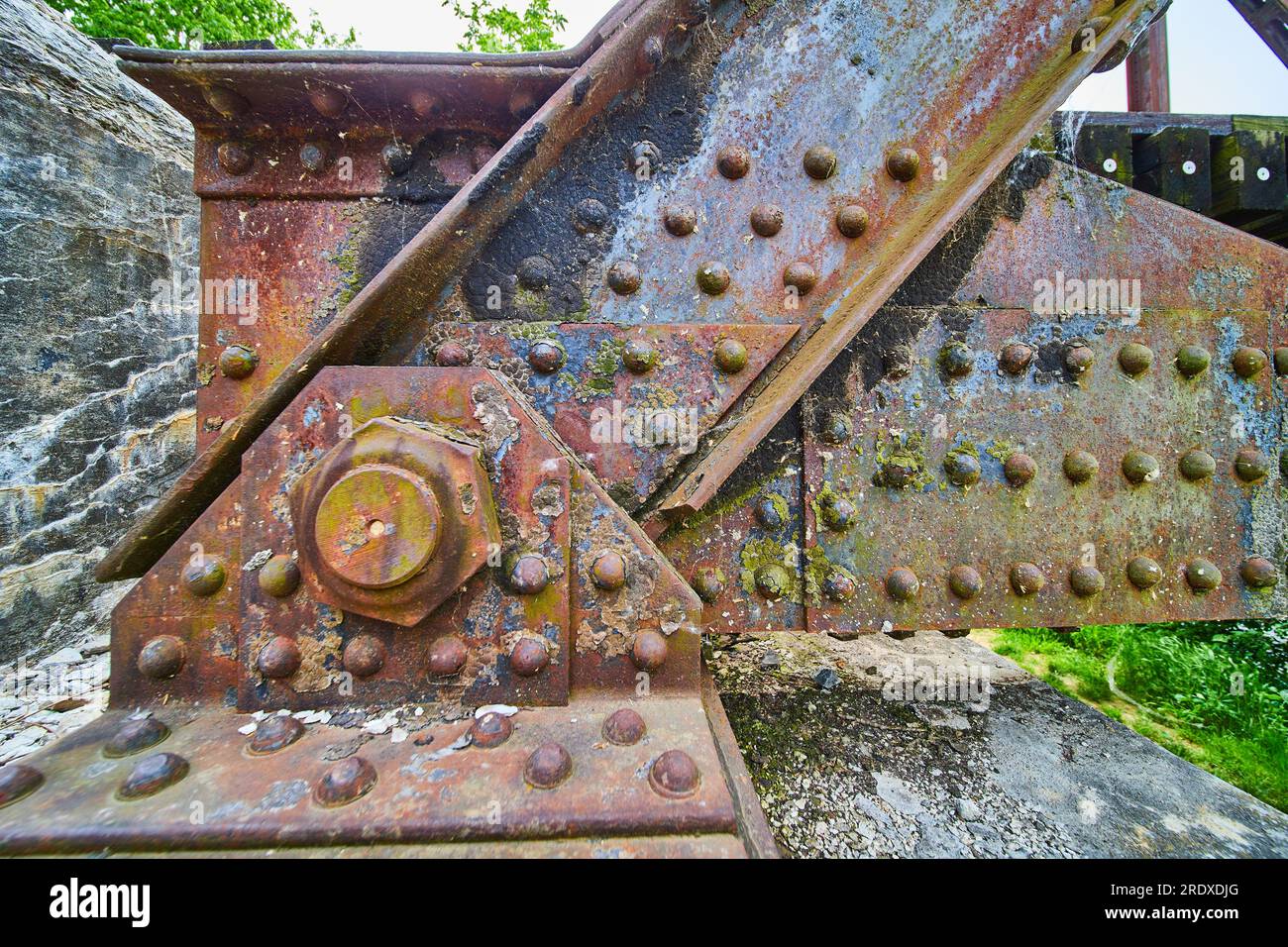 Mottled Effect Rivet Close up of rusty textured metal with rainbow oil spill effect on metal ...