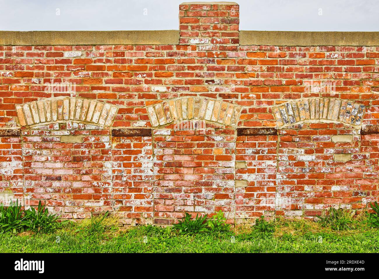 Bricked off doorways with arches on destroyed exterior of building with