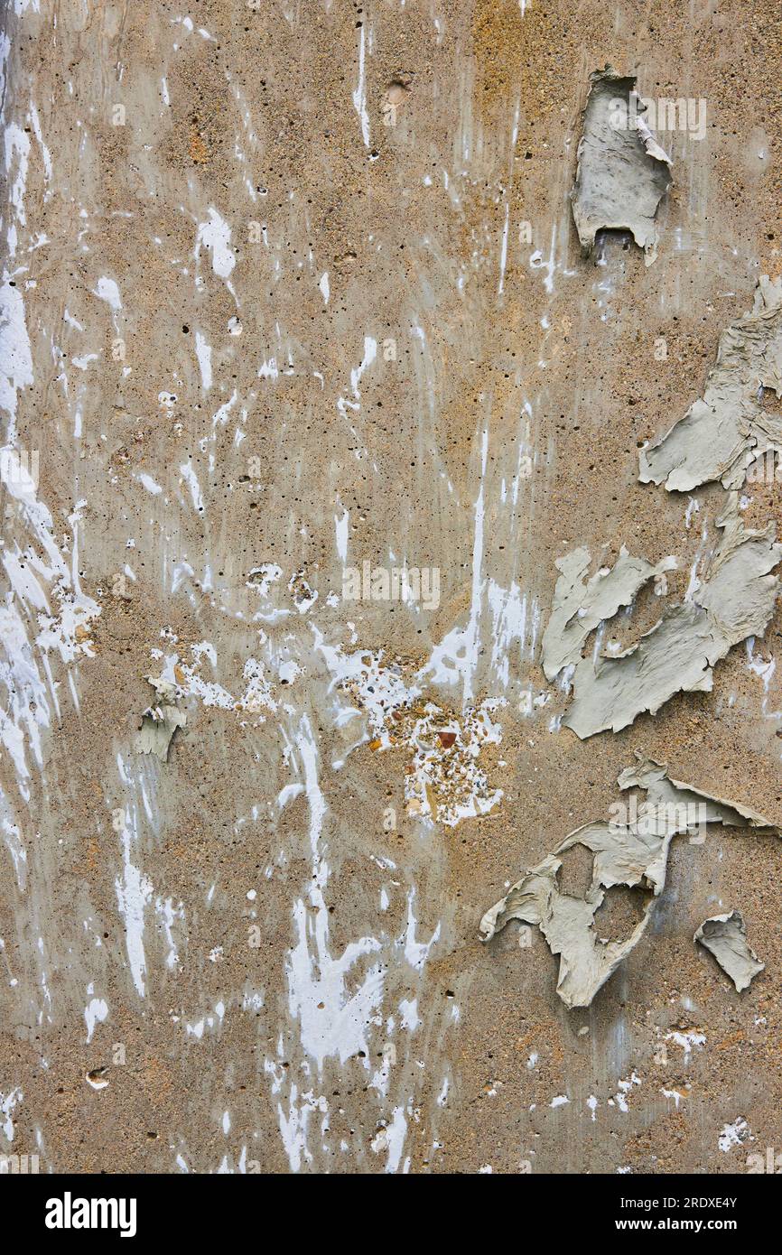 Background asset vertical textured dirty concrete wall with white chalky streaks and flaking
