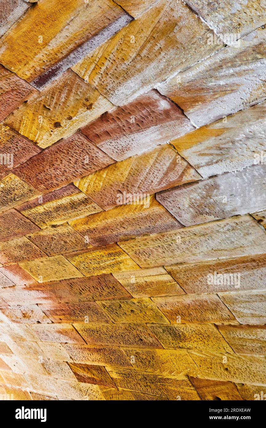Golden stone bricks fading to white streaked bricks background asset of