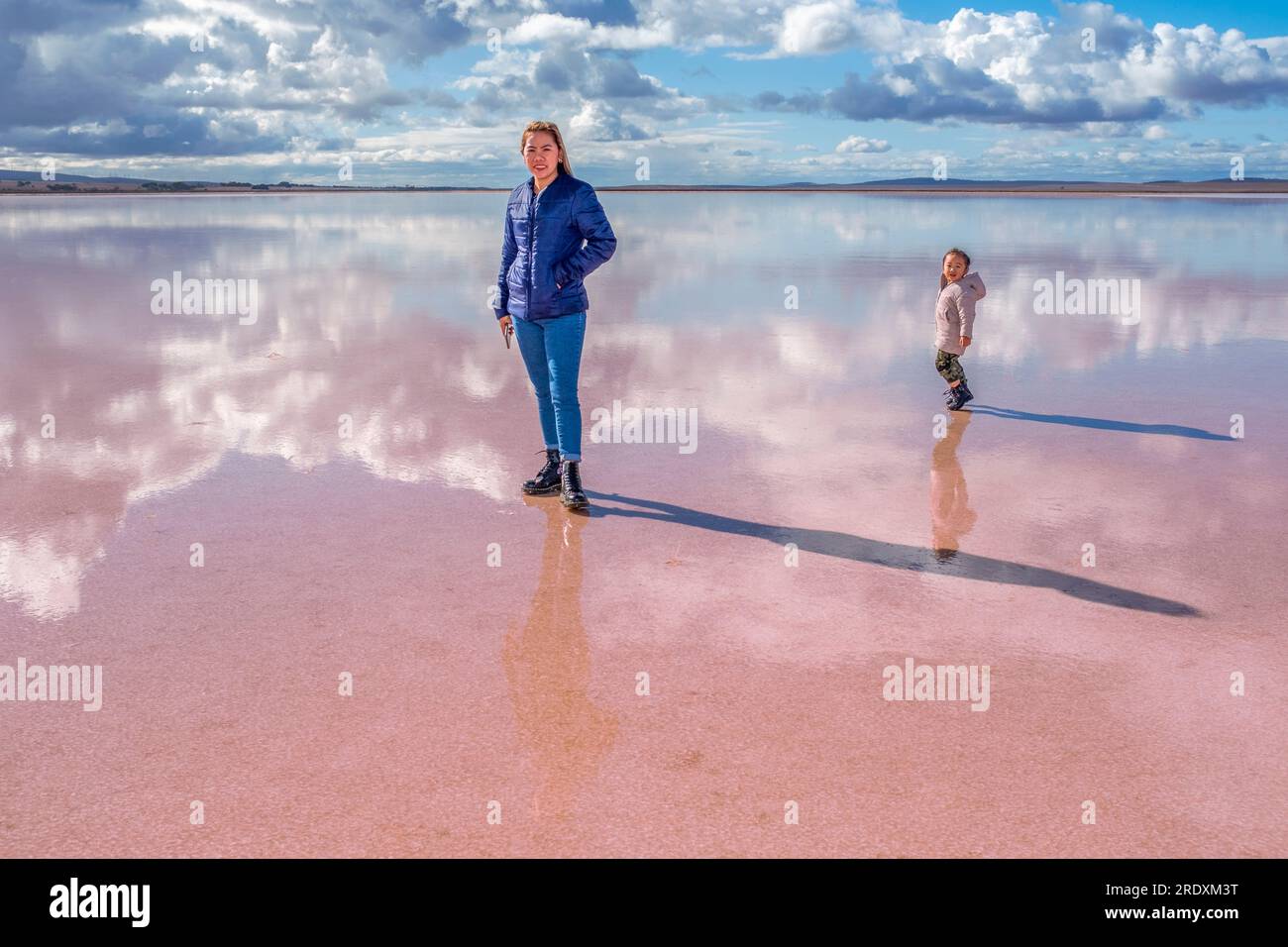 A young female Asian tourist and her pre-school daughter explore Lake Bumbunga, a pink salt lake  in Lochiel in the mid-north of South Australia Stock Photo