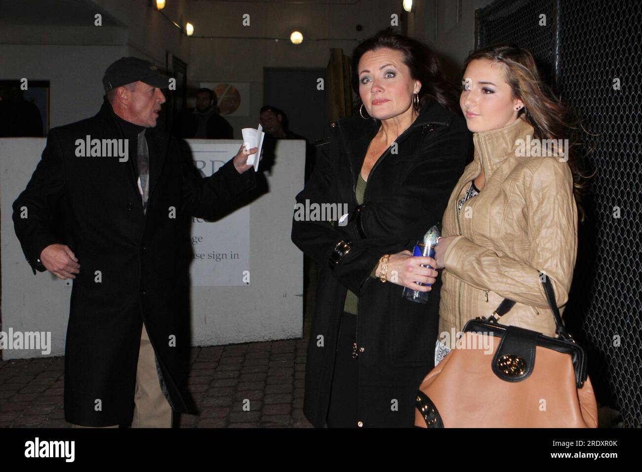 Michael Lohan, Kristi Horn Kaufmann and Ashley Horn leaving the