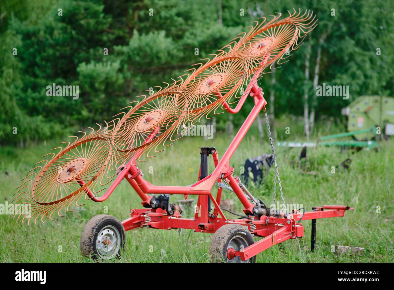Mounted agitator rakes for a tractor for haymaking Stock Photo - Alamy