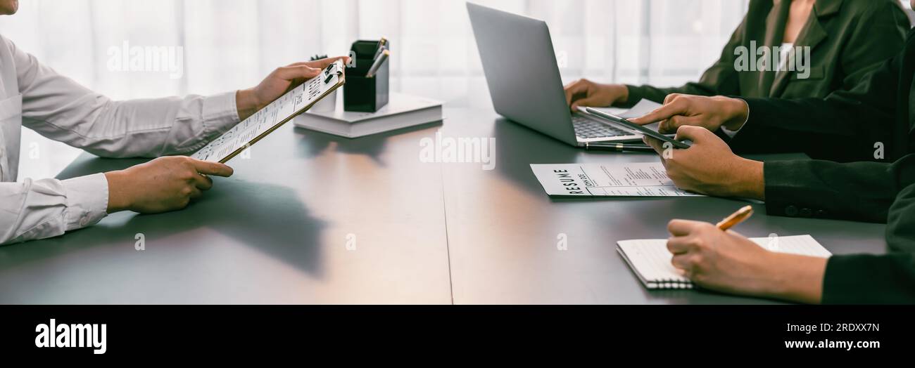 Candidate and interviewers discuss work experience and qualifications