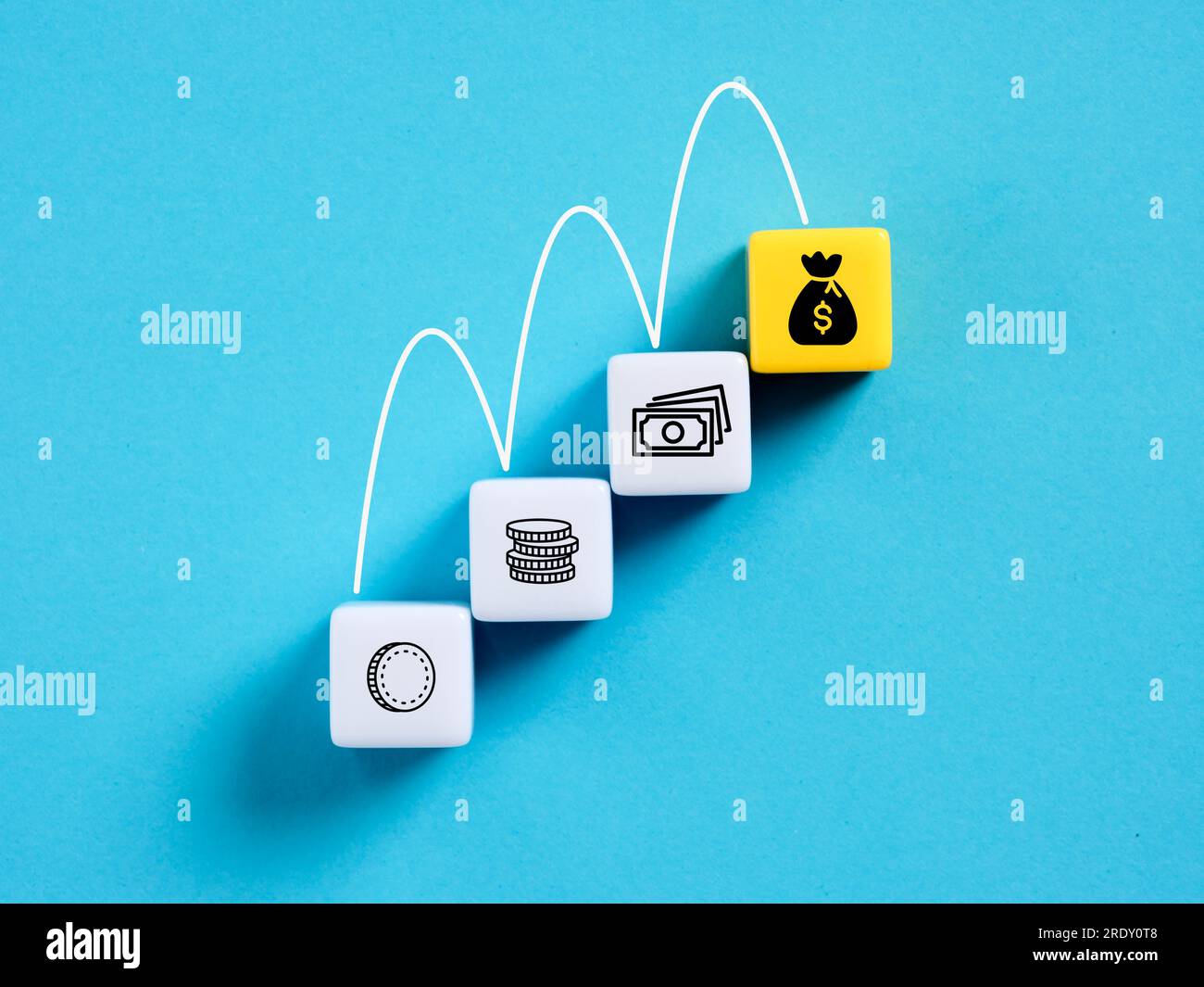 Money growth. Increasing financial investments or savings. Income or profit growth. Money symbols on cubes. Stock Photo