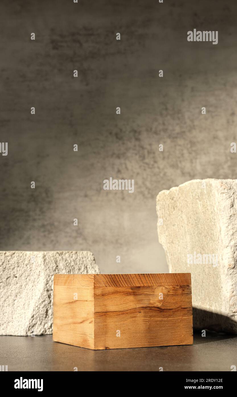 Rough stone and wooden box with sunlight from window on concrete wall and floor background,Copy space for product display Stock Photo