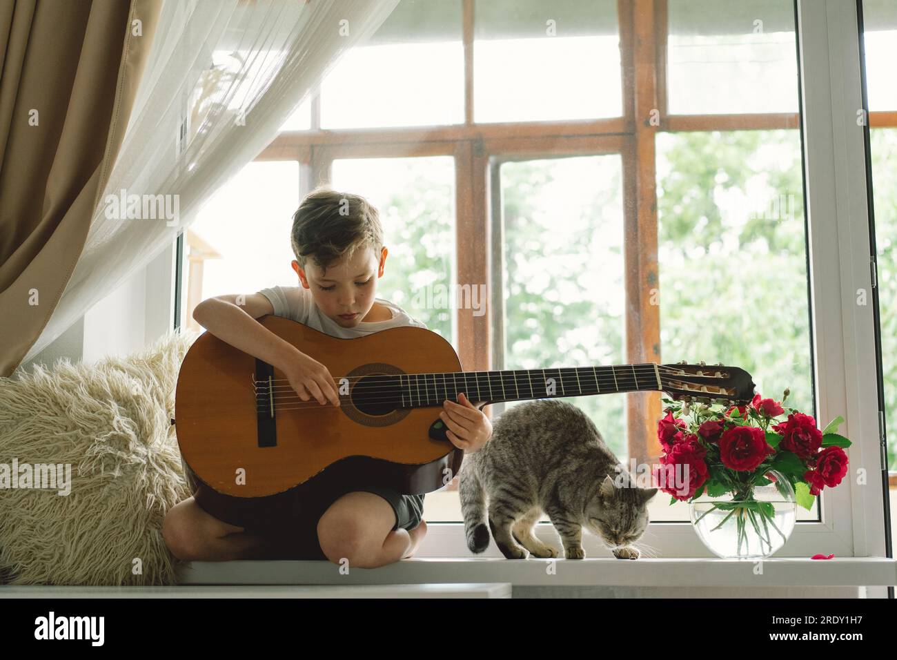 cute boy playing guitar