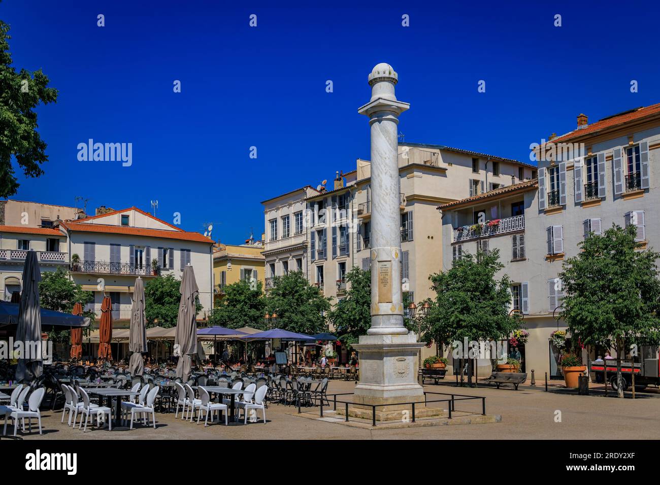 Marble column gifted to Antibes by Louis XVIII in 19th century on Place Nationale square near the provencal market in old town, South of France Stock Photo