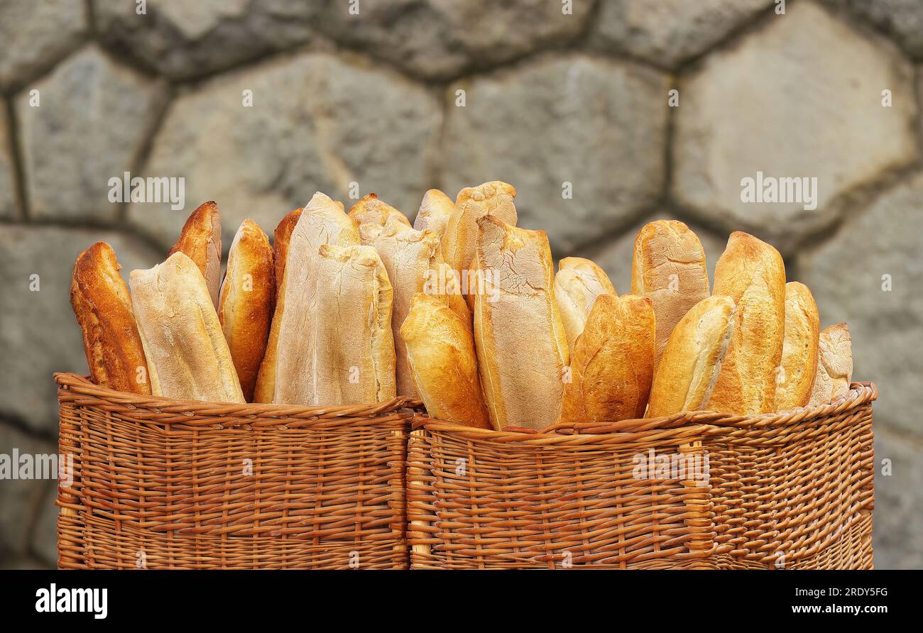 Large wicker baskets filled with Frenchstyle bread at the farmers