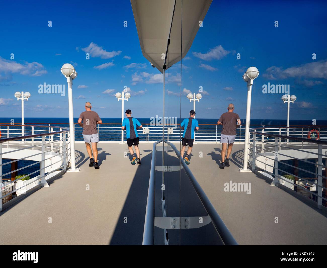 Running tracks are my secret weapon and favoured shooting venue when on board cruise liners. Not only does slogging around them help in the fight agai Stock Photo