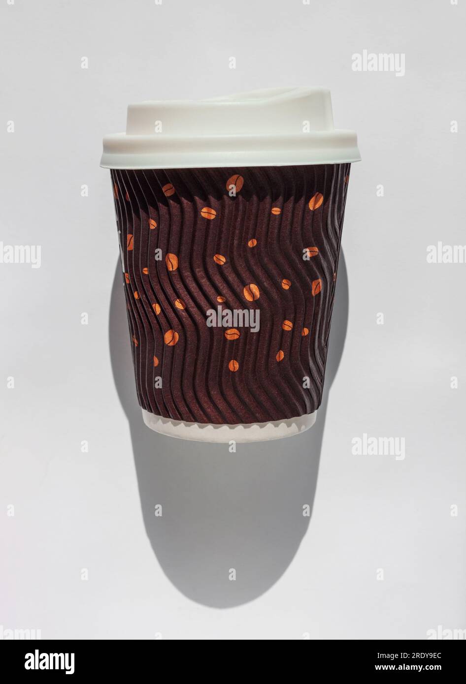 Brown corrugated paper cup with white lid for take away hot drinks in ...