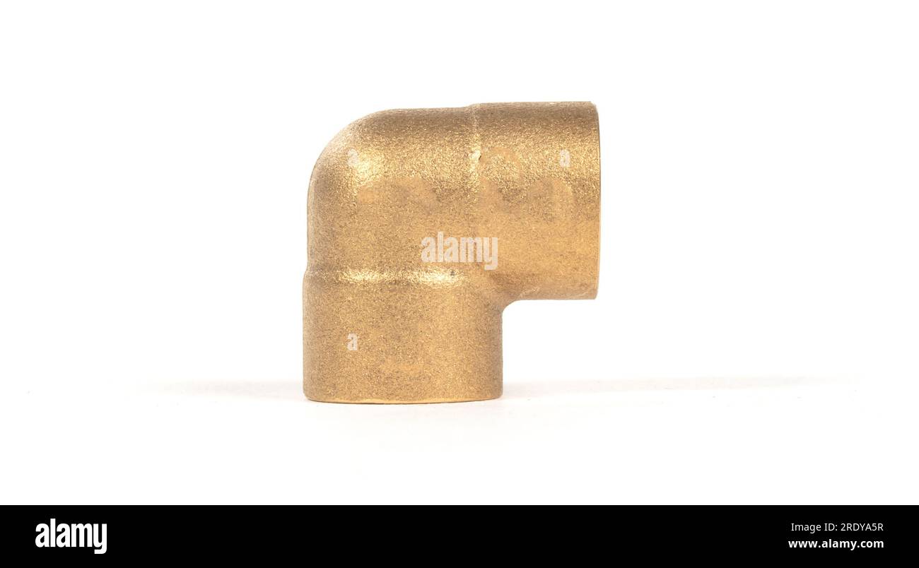 Brass fitting for plumbing pipes, connector for two different sizes, 90 degree angle, isolated