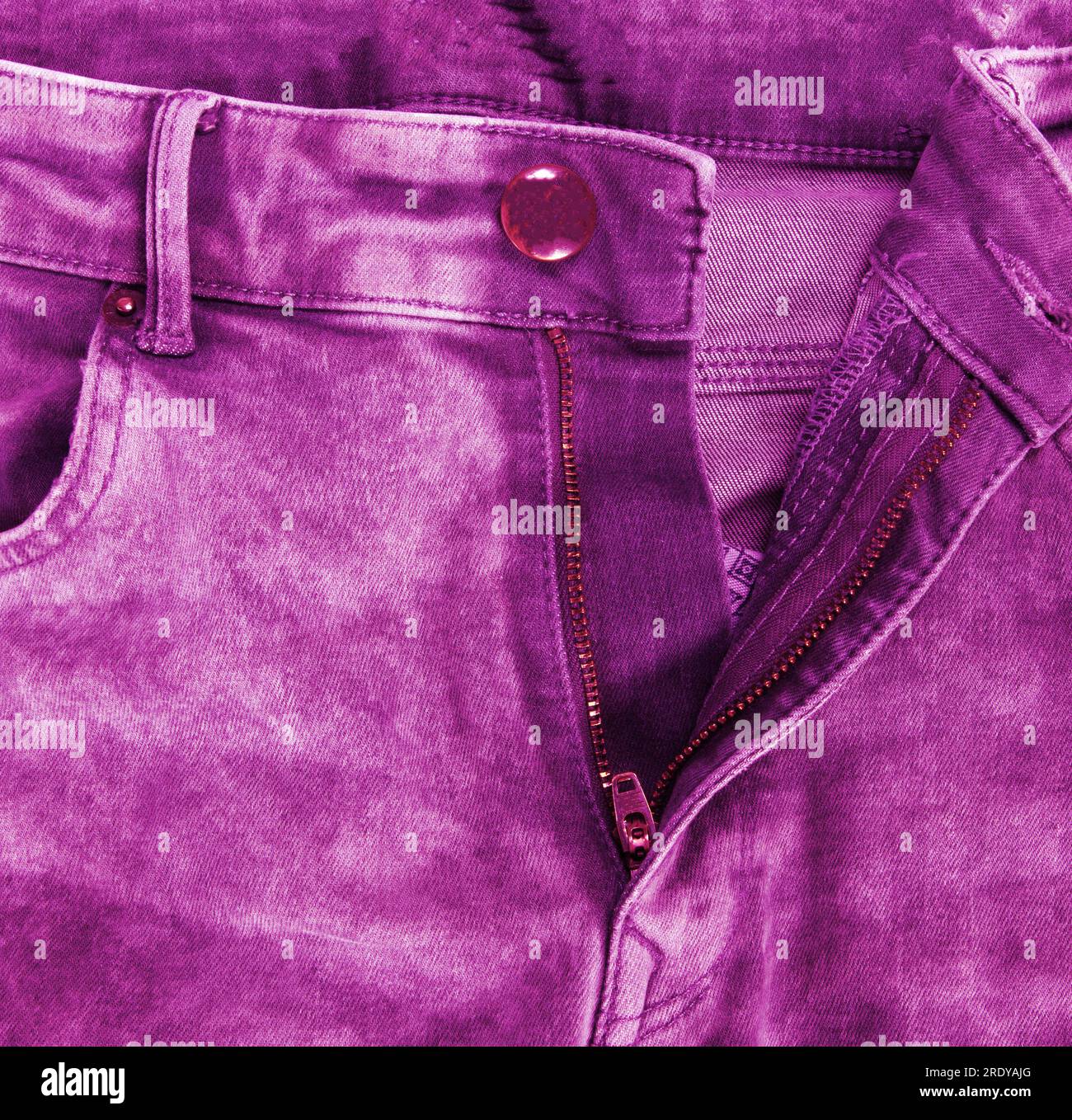 Worn pink jeans isolated on a white background Stock Photo Alamy