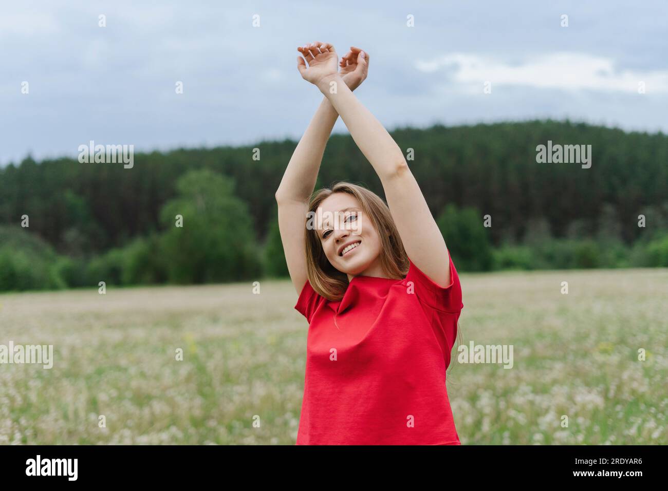 Woman arms up field hi-res stock photography and images - Alamy