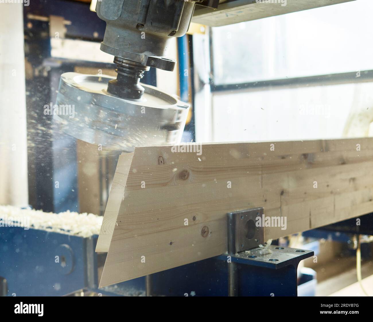 Close-up of machinery spinning on timber in workshop Stock Photo