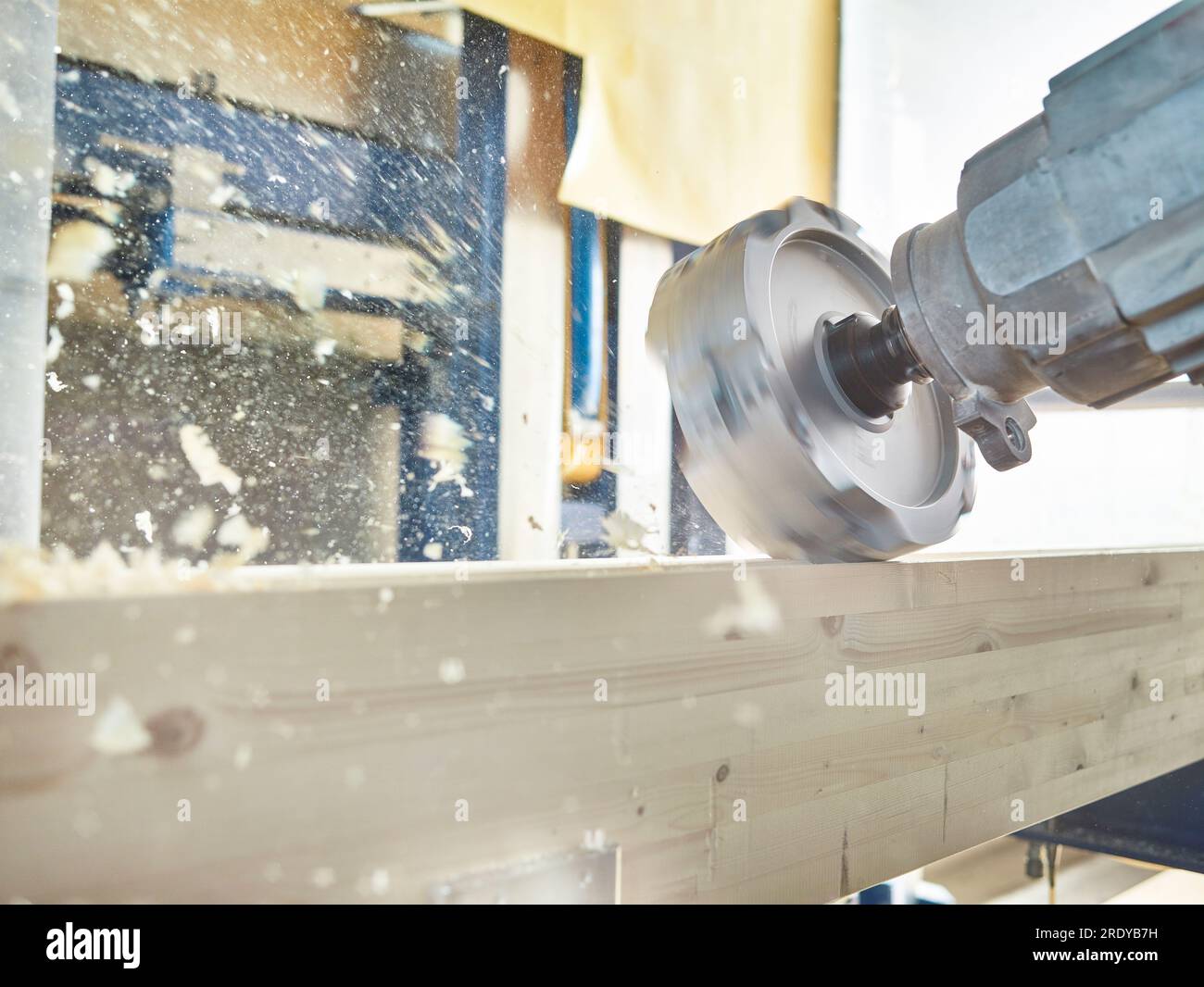 Close-up of machinery with timber in workshop Stock Photo