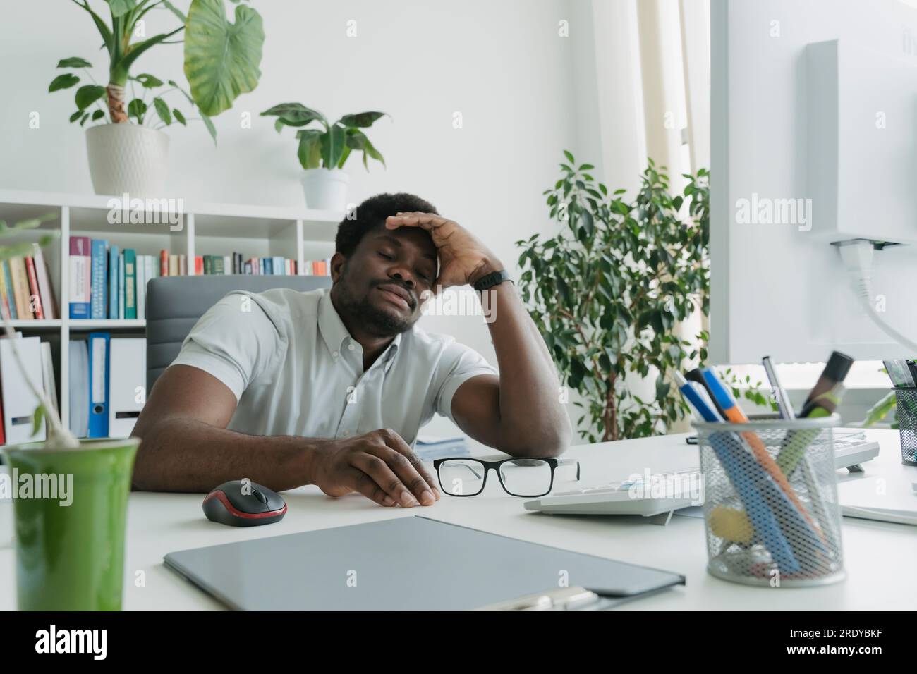 Businessman napping in office hi-res stock photography and images - Alamy