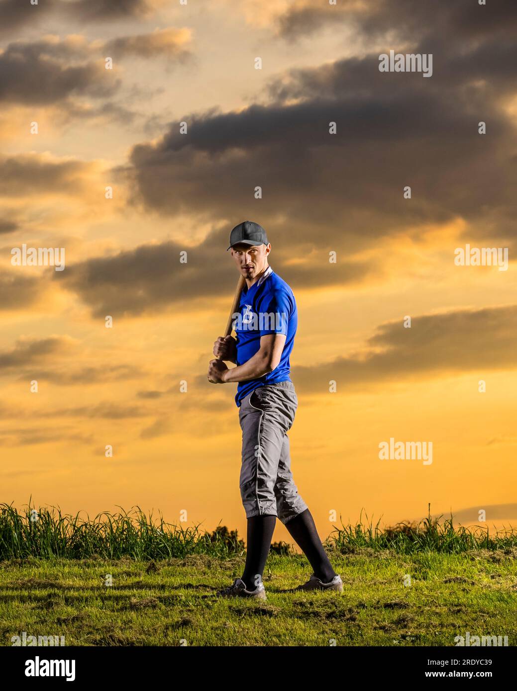 Im here to win. Shot of a young baseball player holding a baseball bat  while posing outside on the pitch Stock Photo - Alamy