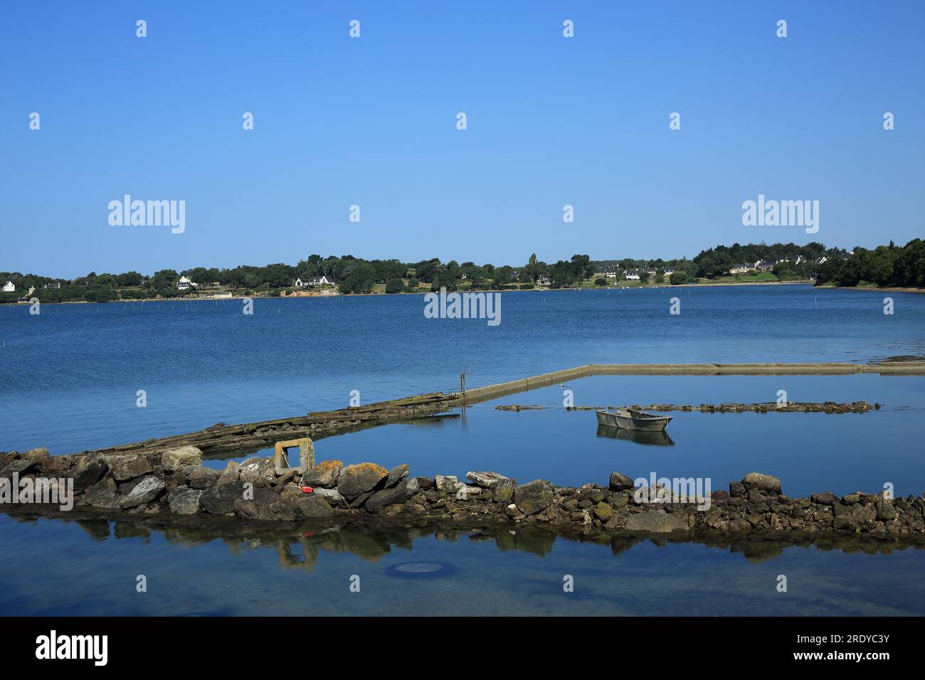 View across oyster farm over Anse de Kerdelan from sentier cotier close